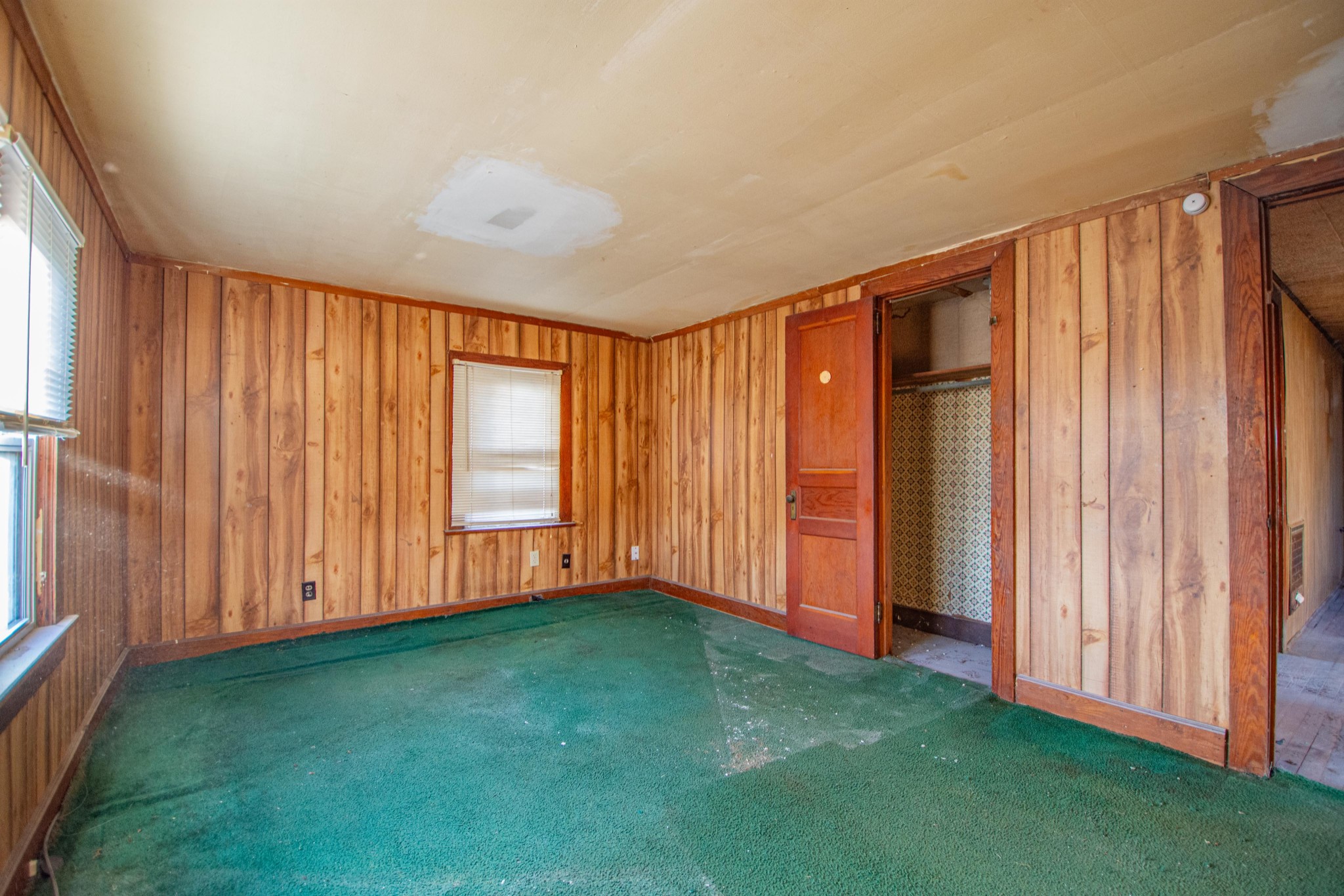632 East Madison Street Pulaski, TN 38478 - Photo 10 of 22 a view of an empty room with window and stairs