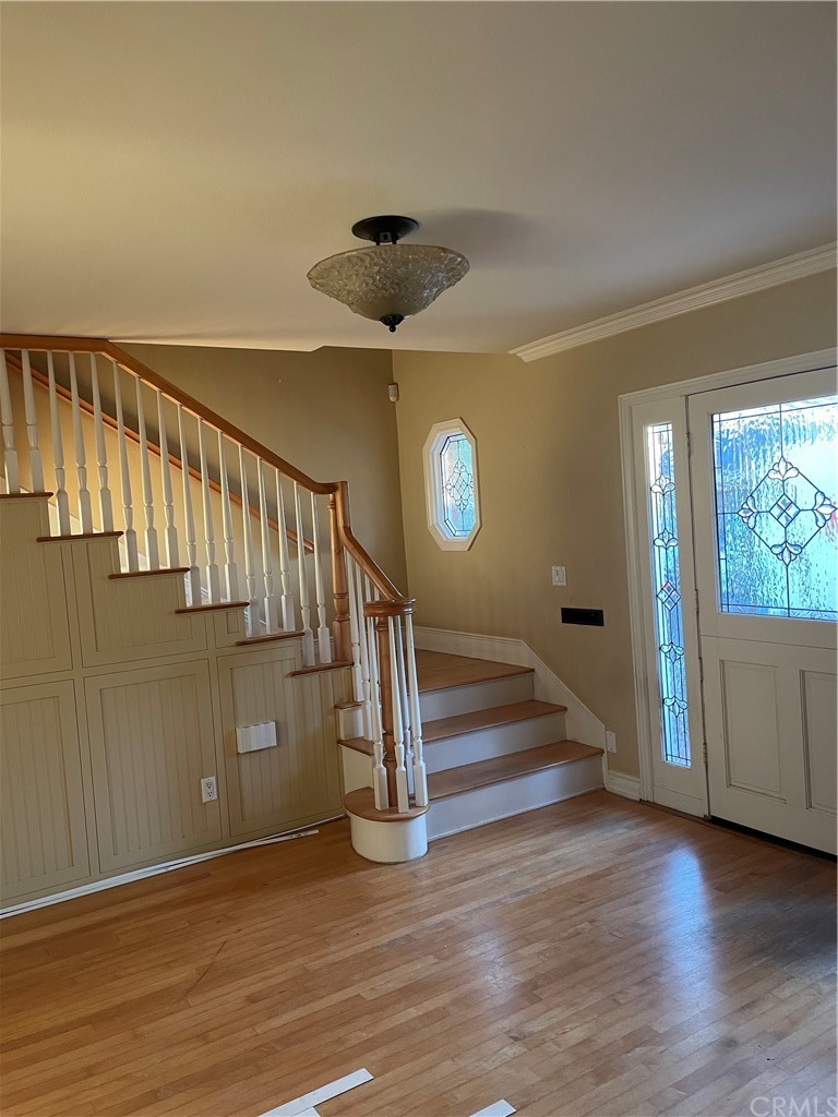 239 16th Street Seal Beach, CA 90740 - Photo 2 of 11 a view of entryway and hall with wooden floor