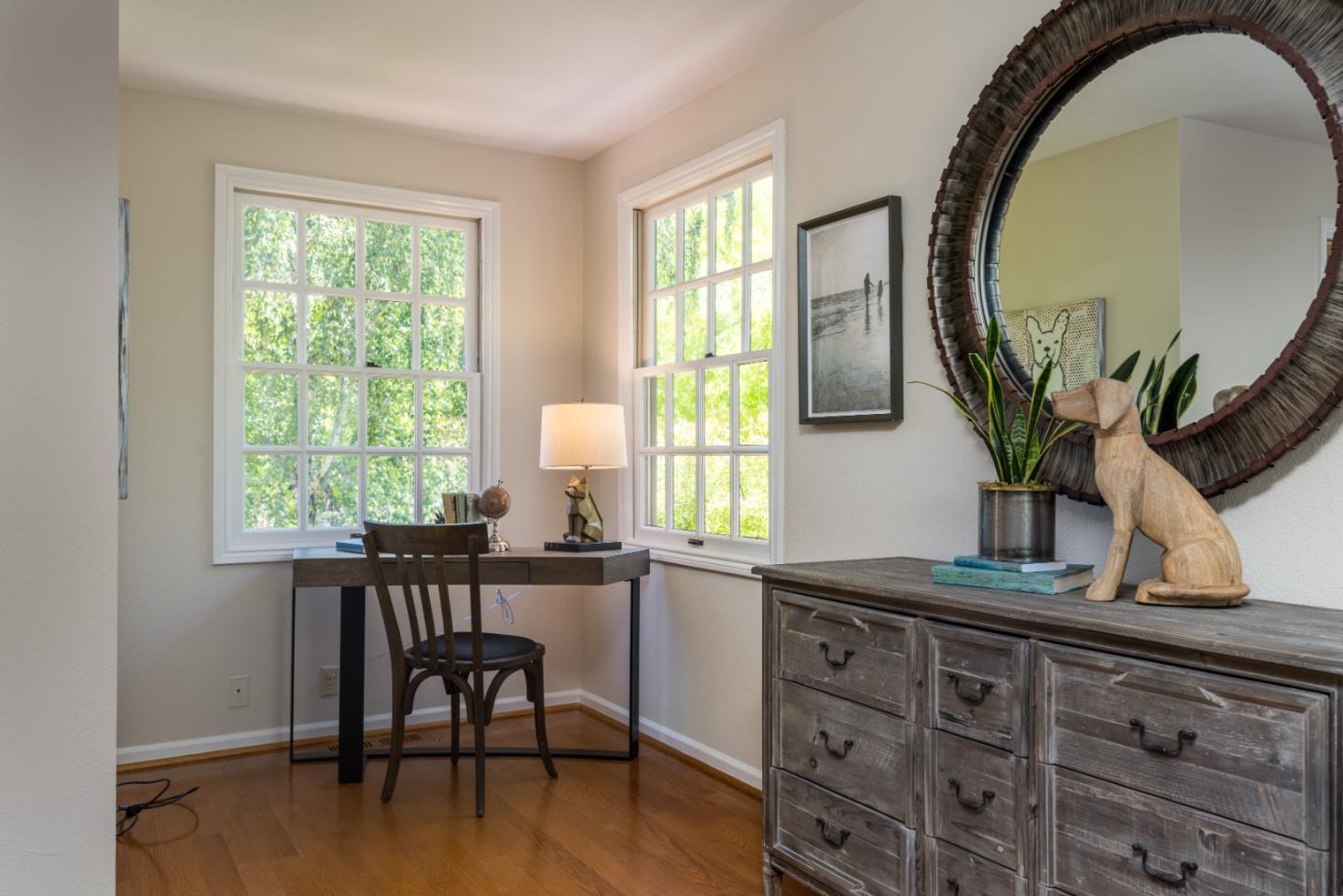 400 Warren Road San Mateo, CA 94402 - Photo 18 of 54 a dining room with furniture and wooden floor