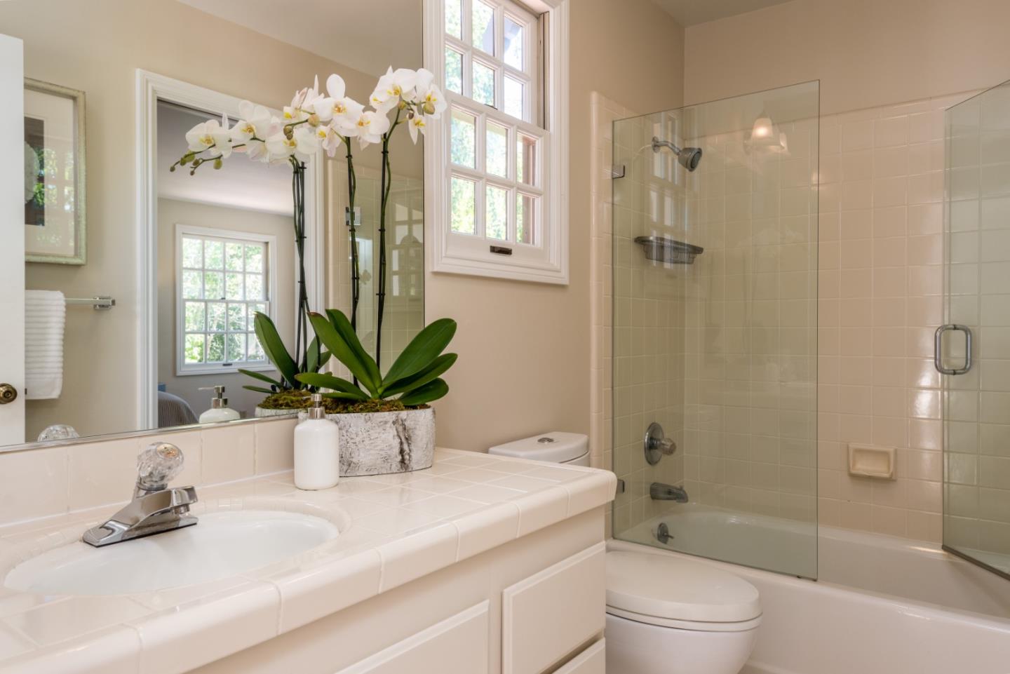 400 Warren Road San Mateo, CA 94402 - Photo 19 of 54 a bathroom with a sink a toilet and shower