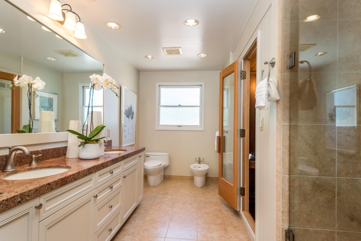 400 Warren Road San Mateo, CA 94402 - Photo 26 of 54 a spacious bathroom with a granite countertop sink mirror and a bathtub