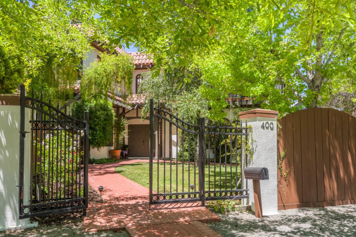 400 Warren Road San Mateo, CA 94402 - Photo 3 of 54 a view of a house with a tree in the background