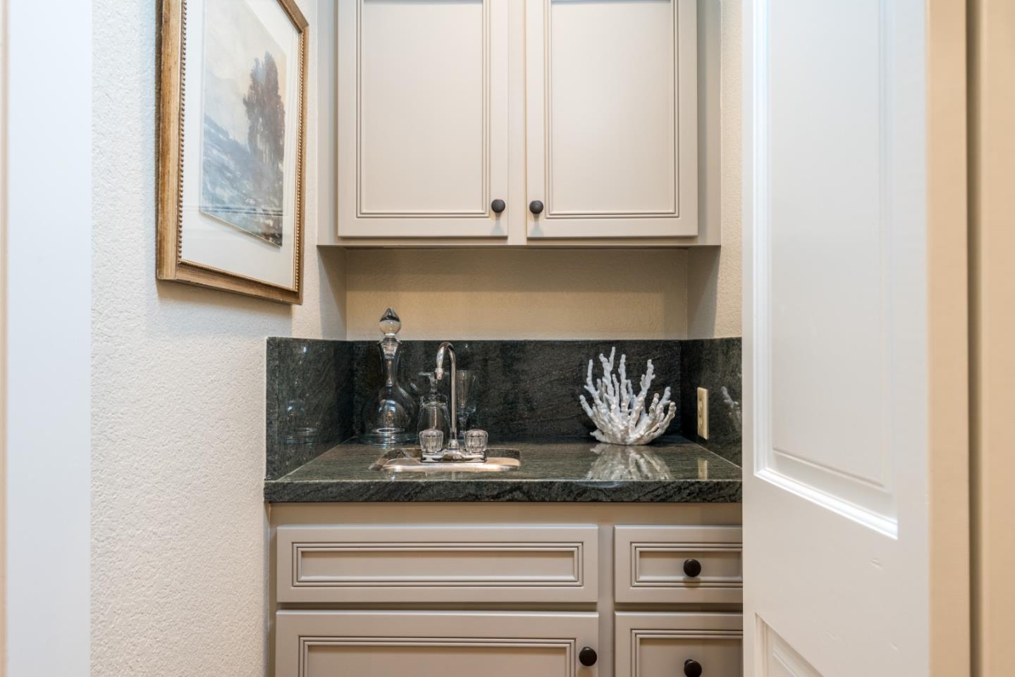 400 Warren Road San Mateo, CA 94402 - Photo 33 of 54 a kitchen with a sink and cabinets