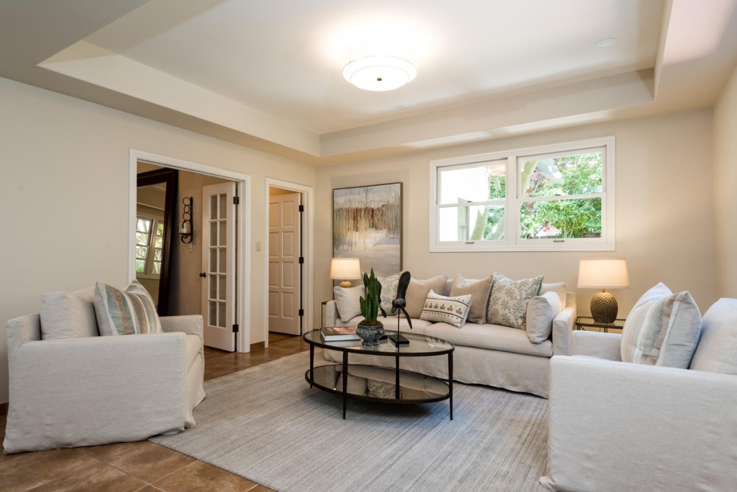 400 Warren Road San Mateo, CA 94402 - Photo 37 of 54 a living room with furniture and a large window