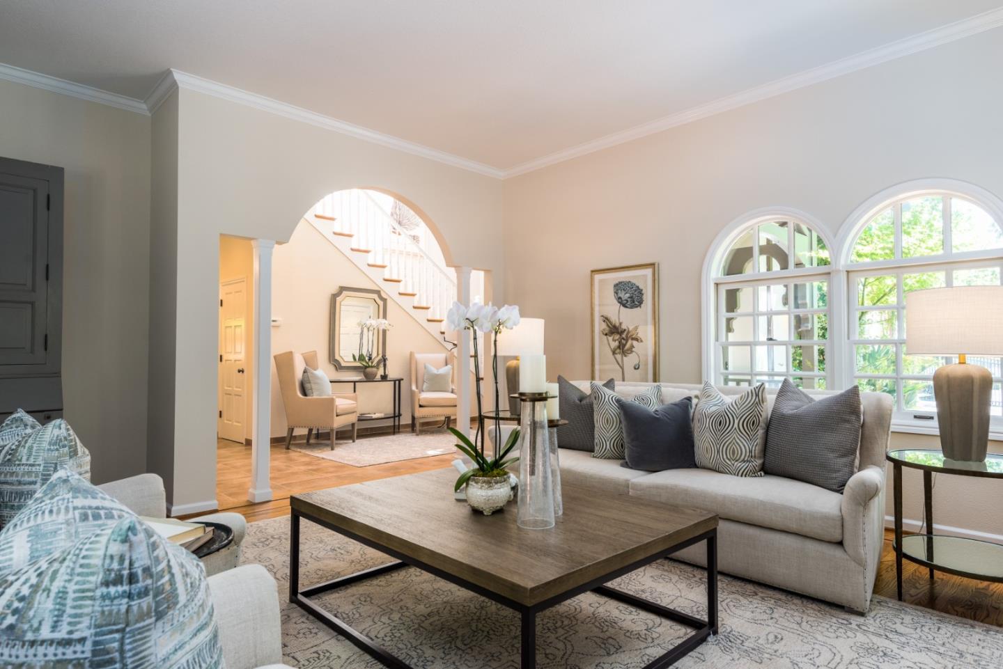 400 Warren Road San Mateo, CA 94402 - Photo 42 of 54 a living room with furniture a table and a chandelier