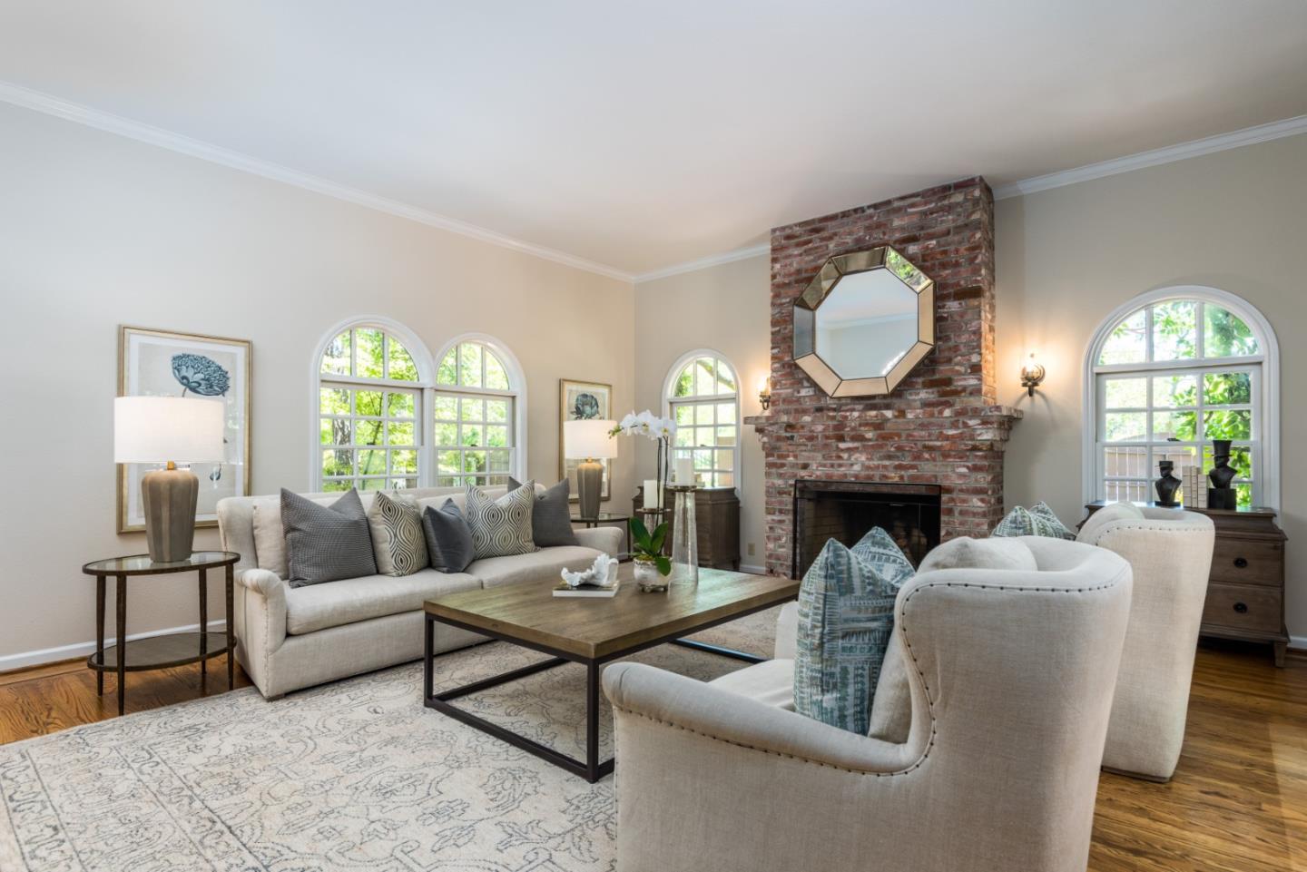 400 Warren Road San Mateo, CA 94402 - Photo 43 of 54 a living room with furniture a fireplace and a large window