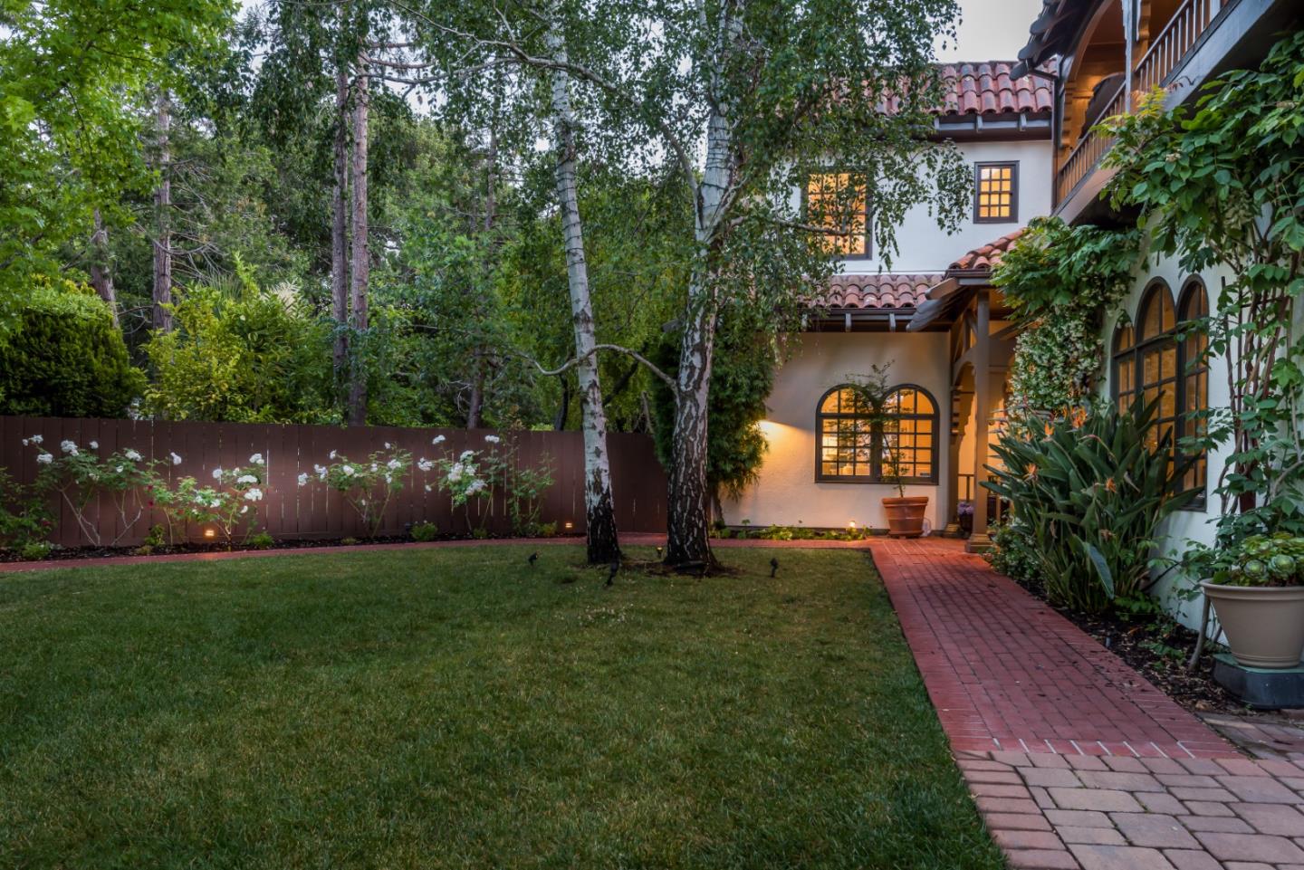 400 Warren Road San Mateo, CA 94402 - Photo 52 of 54 a view of a garden with a house