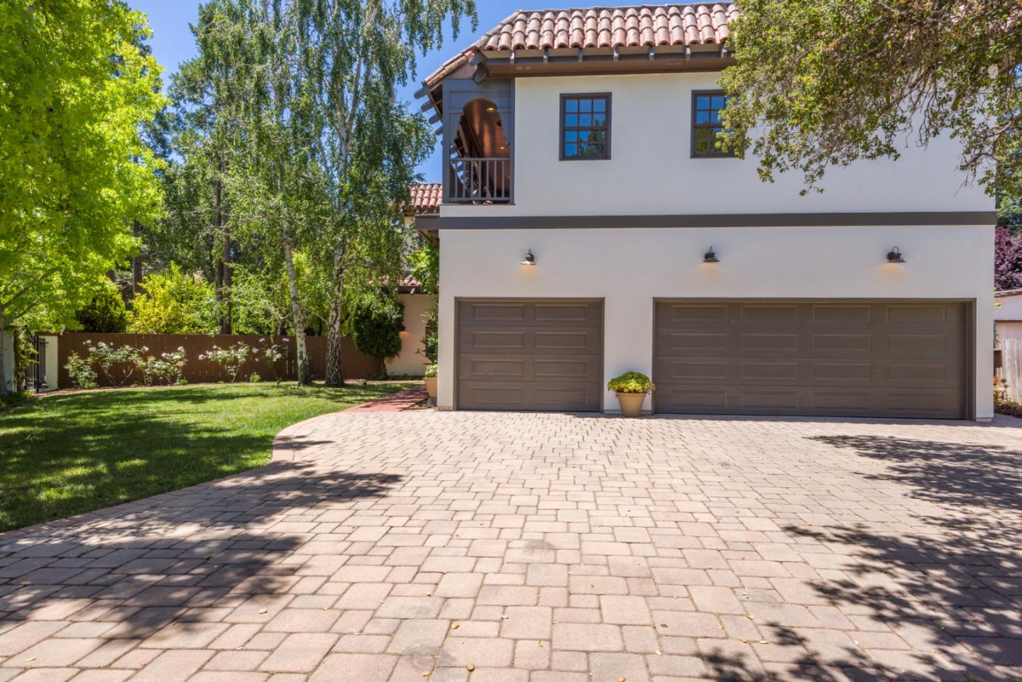 400 Warren Road San Mateo, CA 94402 - Photo 9 of 54 a front view of a house with a yard and a garage