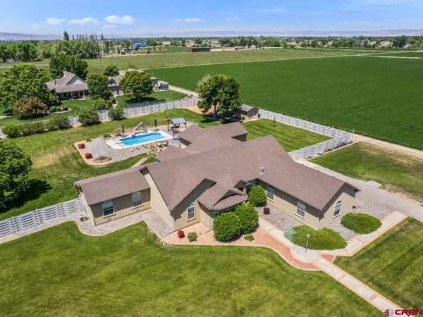 an aerial view of a house with outdoor space swimming pool and outdoor seating
