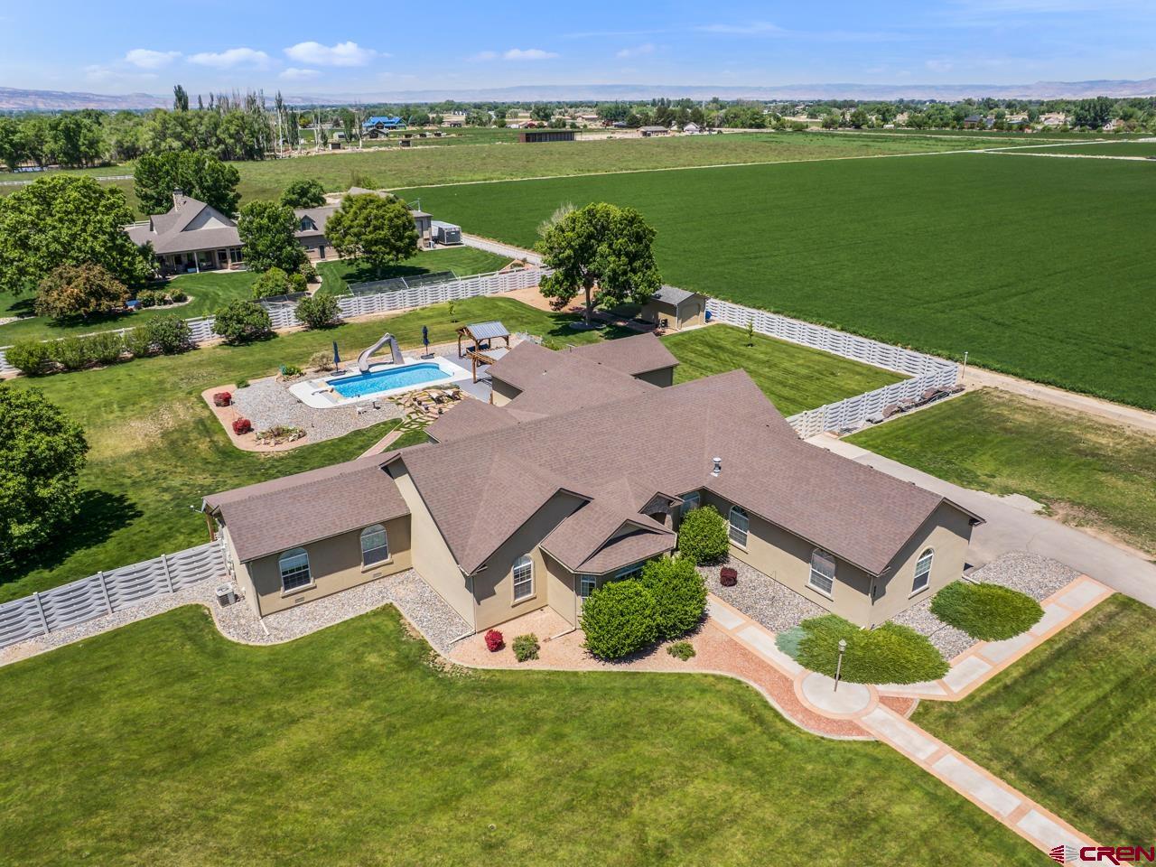an aerial view of a house with outdoor space swimming pool and outdoor seating