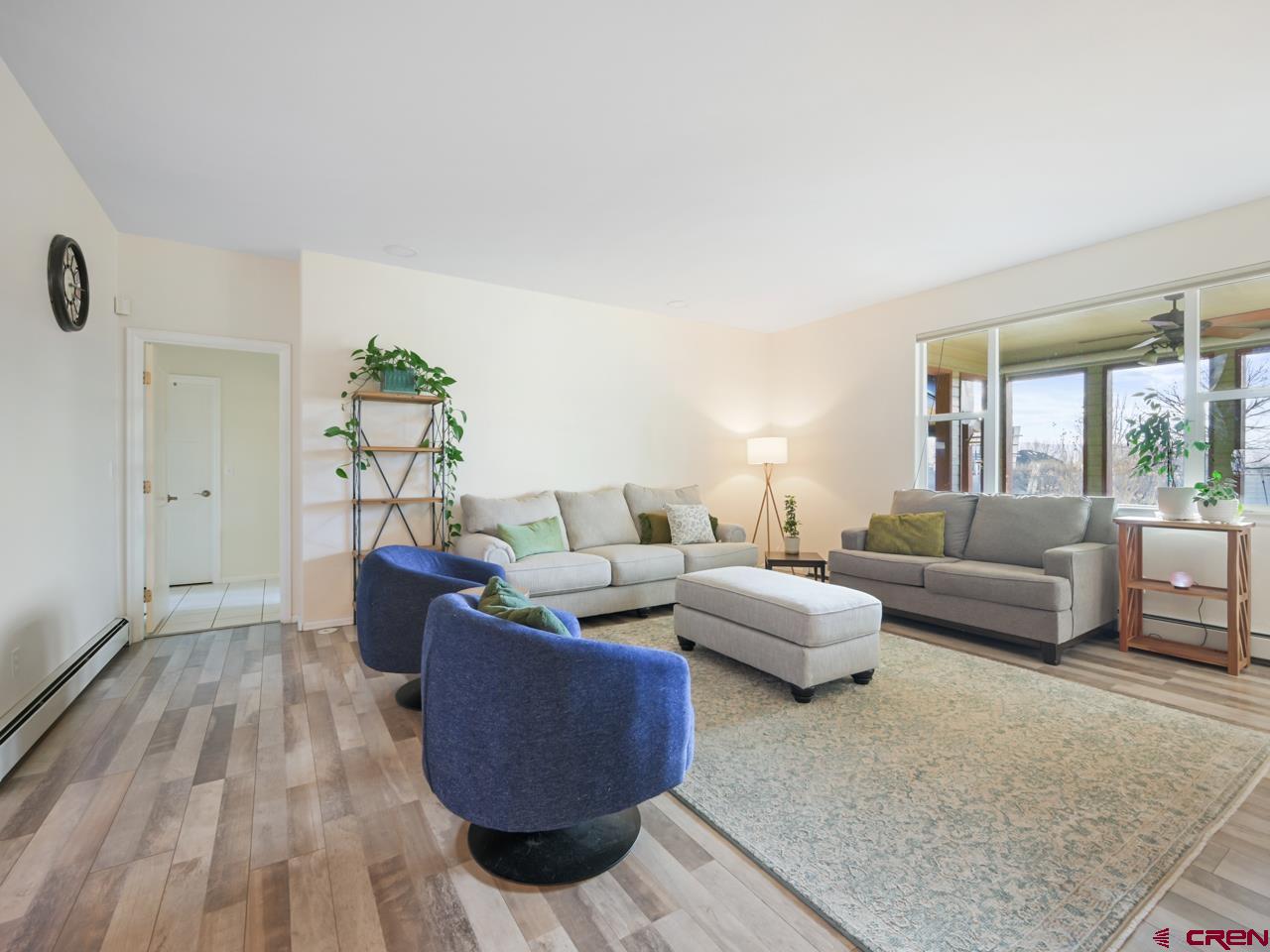 895 24 1/2 Road Grand Junction, CO 81505 - Photo 6 of 42 a living room with furniture and wooden floor