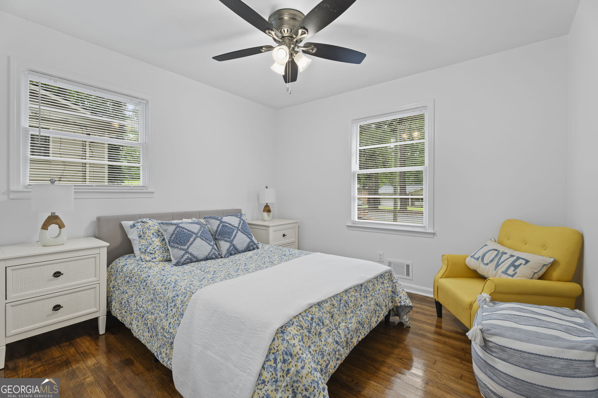 3567 Forrest Park Road Southeast Atlanta, GA 30354 - Photo 17 of 29 a bedroom with a bed and wooden floor