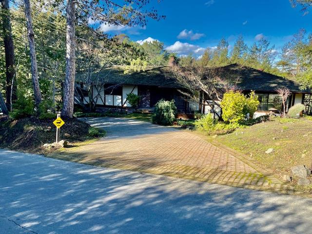 1300 La Honda Road Hillsborough, CA 94010 - Photo 1 of 17 a view of a house with a patio