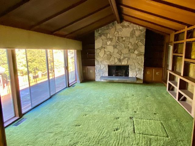 1300 La Honda Road Hillsborough, CA 94010 - Photo 5 of 17 a view of an empty room with a fireplace and a window