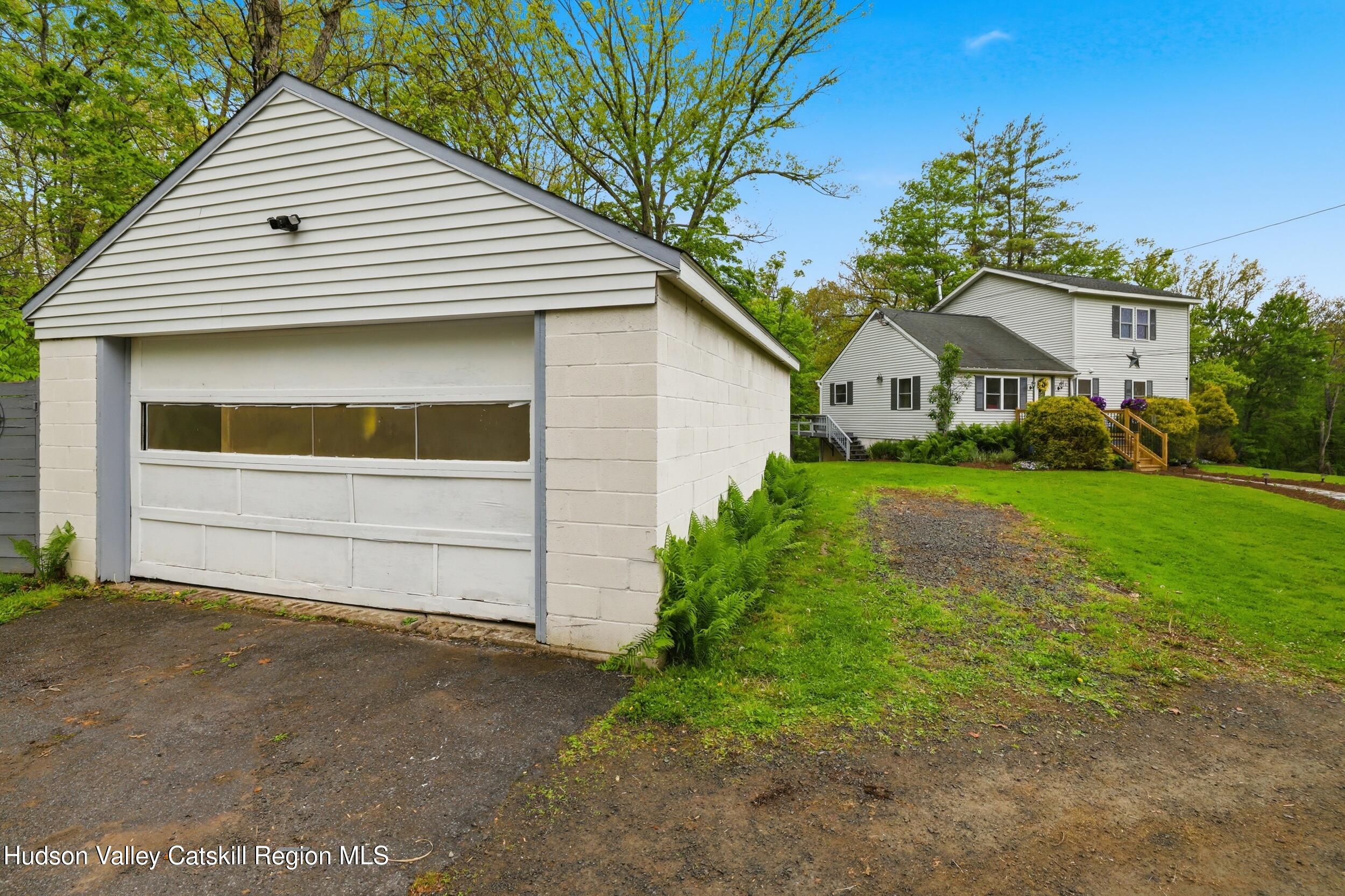 186 Cedar Hill Road High Falls, NY 12440 - Photo 30 of 33 a front view of a house with a yard and garage