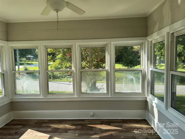 a view of empty room with window and outdoor view
