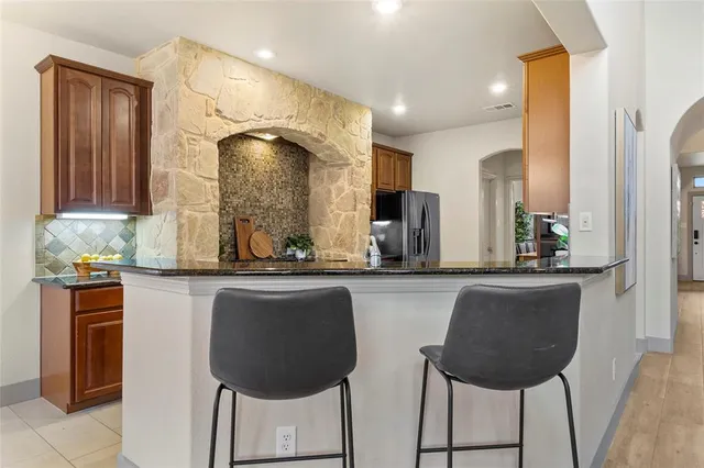 a kitchen with a sink cabinets and window