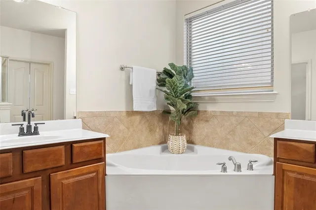 a bathroom with a sink a vanity and a mirror