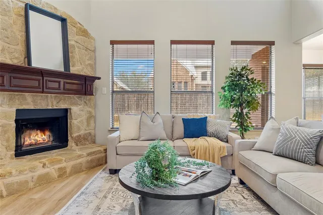 a living room with furniture and a fireplace