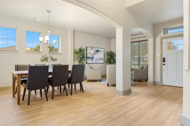 a view of a dining room with furniture and wooden floor