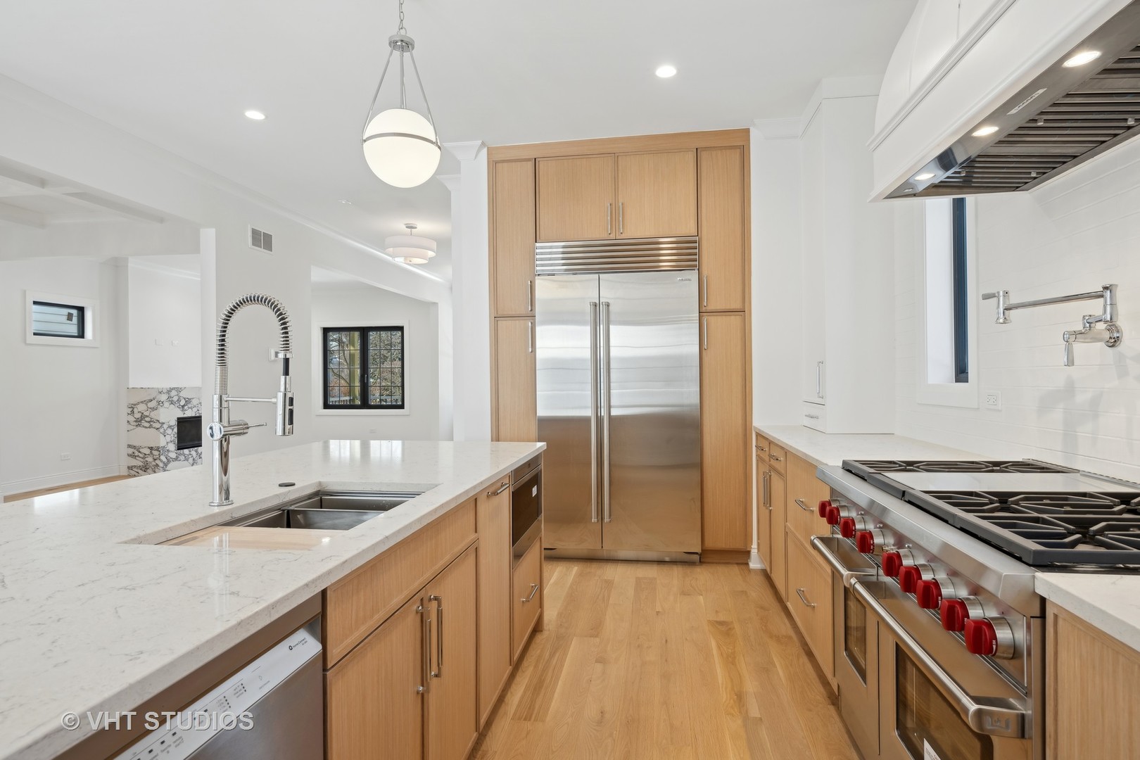 399 Ridge Avenue Winnetka, IL 60093 - Photo 11 of 45 a kitchen with stainless steel appliances a sink stove and cabinets
