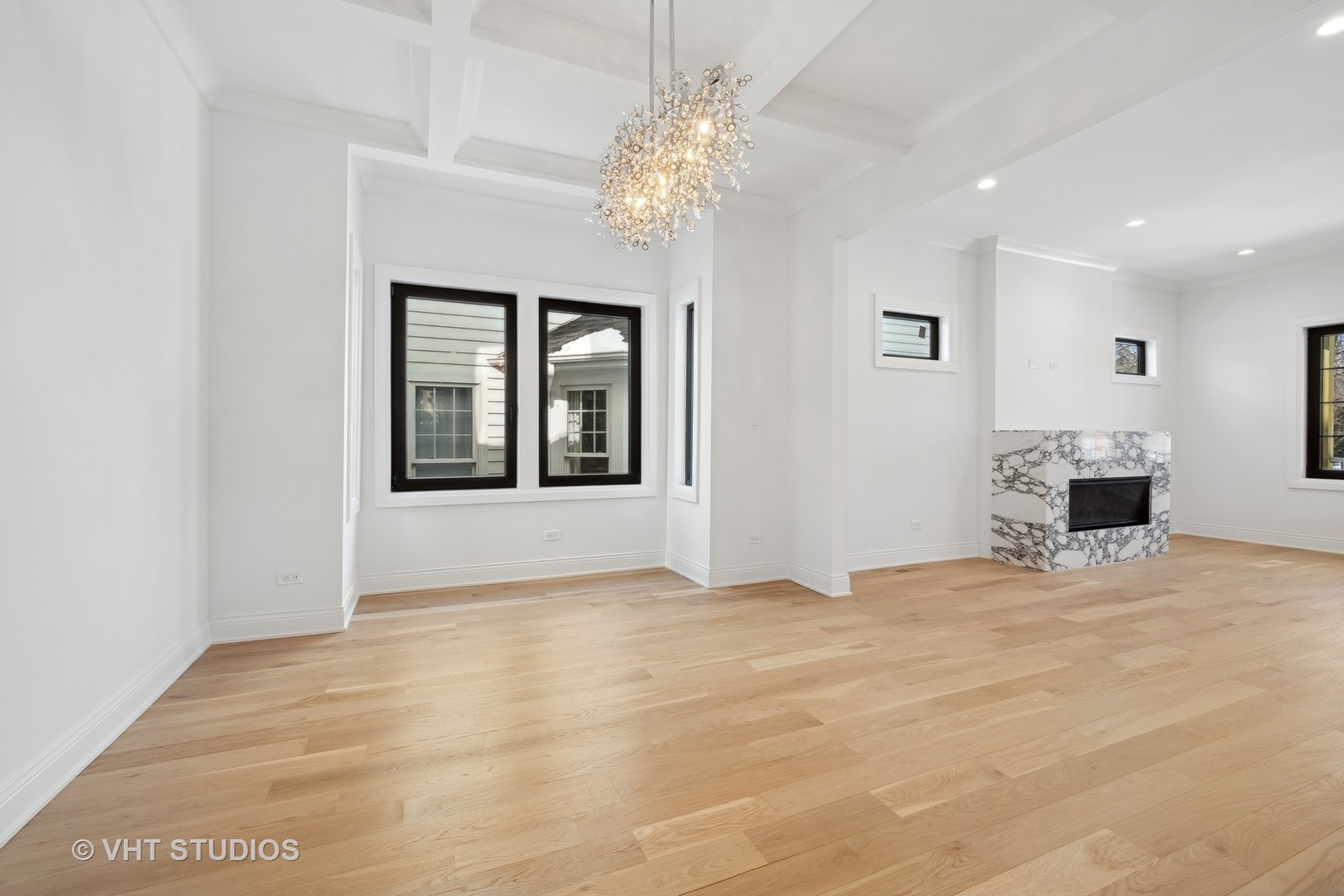 399 Ridge Avenue Winnetka, IL 60093 - Photo 13 of 45 a view of an empty room with chandelier and a window