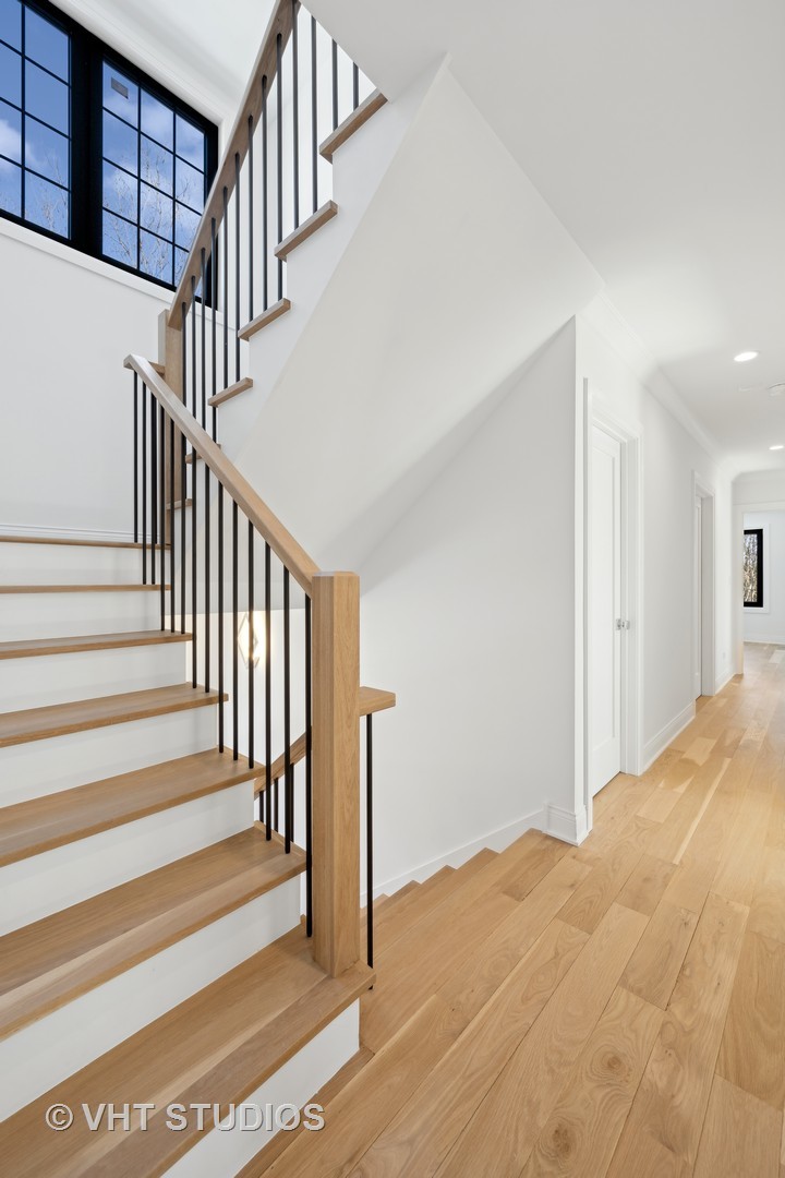 399 Ridge Avenue Winnetka, IL 60093 - Photo 19 of 45 a view of a hallway with staircase