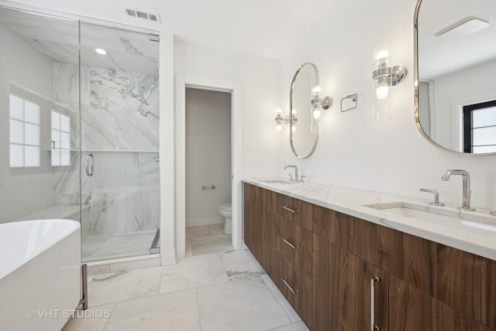 399 Ridge Avenue Winnetka, IL 60093 - Photo 22 of 45 a bathroom with a double vanity sink mirror double and shower