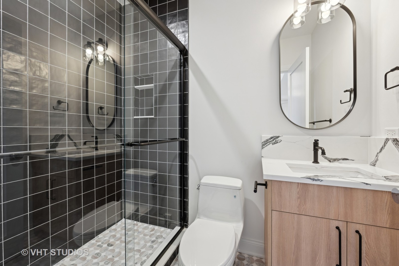 399 Ridge Avenue Winnetka, IL 60093 - Photo 31 of 45 a bathroom with a sink a toilet and a mirror