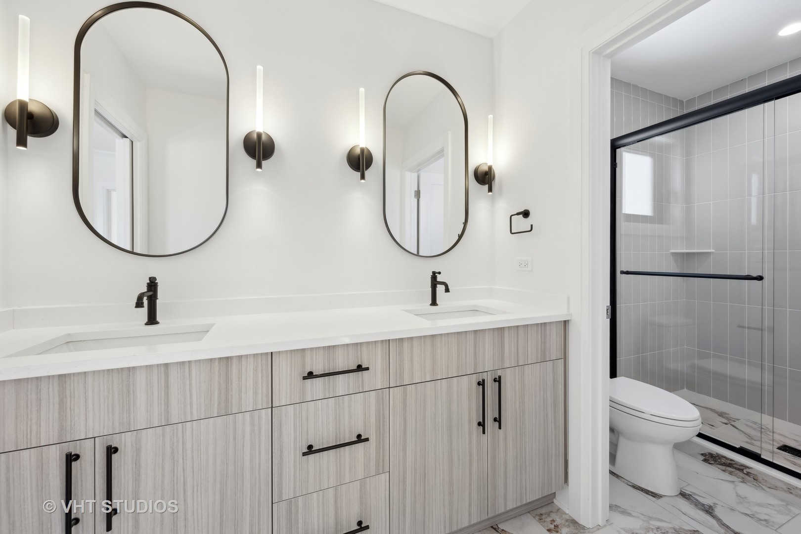 399 Ridge Avenue Winnetka, IL 60093 - Photo 33 of 45 a bathroom with a sink and mirror