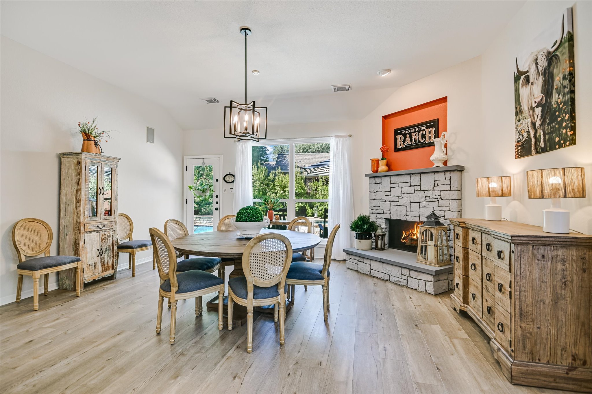 2900 Grimes Ranch Road Austin, TX 78732 - Photo 13 of 38 The inviting family room is anchored by a cozy fireplace that creates a warm focal point for the space.