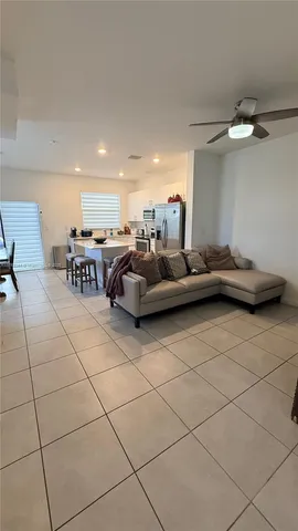 a living room with furniture and a table