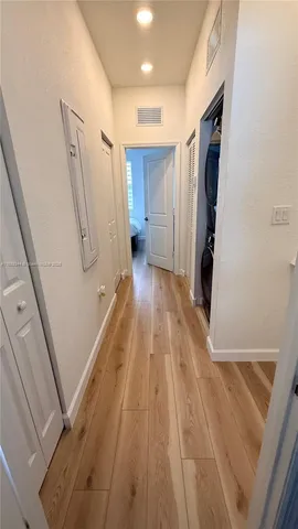 a view of a refrigerator in a kitchen