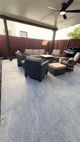 a view of a couches and table in a patio