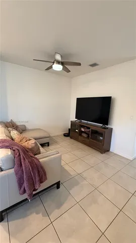 a living room with a couch and a flat screen tv