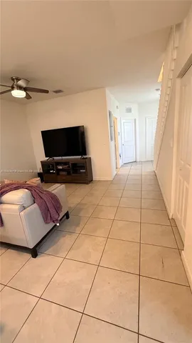 a living room with a couch and a flat screen tv