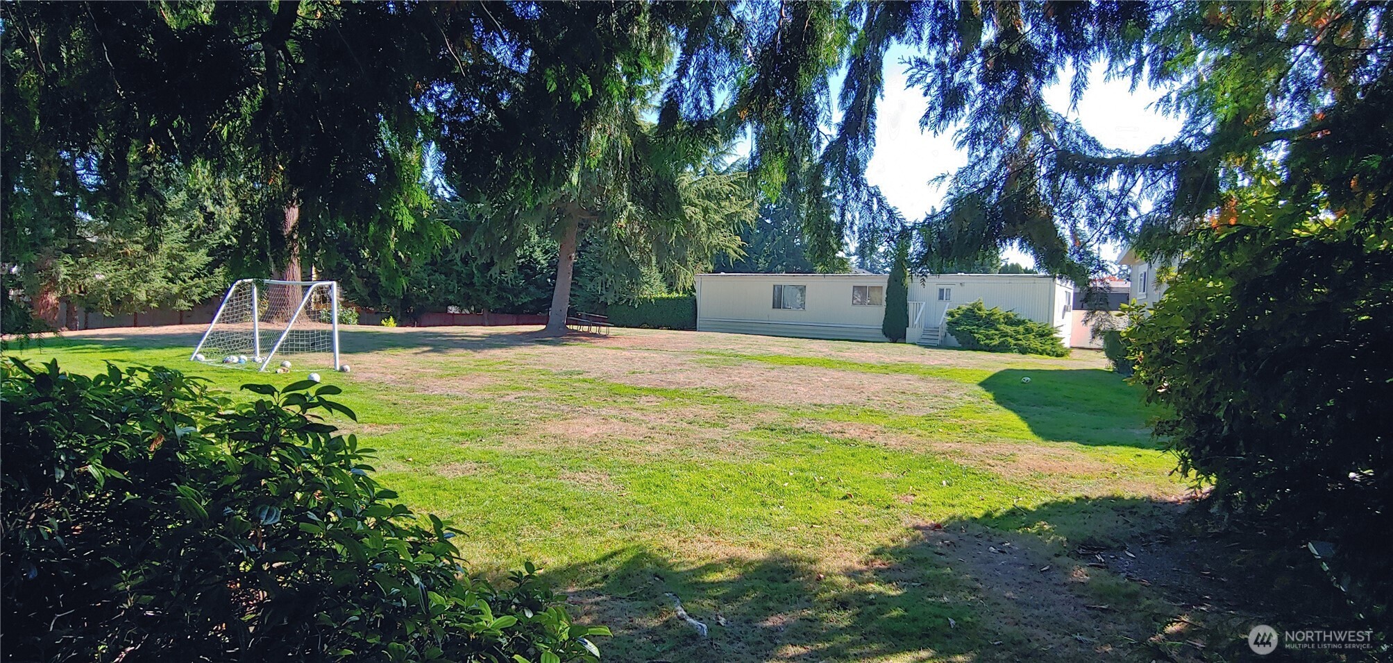 3504 Seattle Hill Road, Unit 30 Bothell, WA 98012 - Photo 21 of 23 a swimming pool with some trees and plants