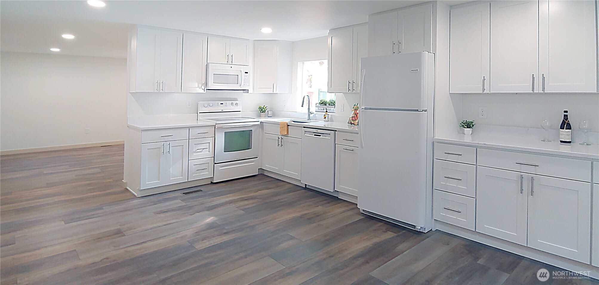 3504 Seattle Hill Road, Unit 30 Bothell, WA 98012 - Photo 10 of 23 a kitchen with white cabinets and white appliances