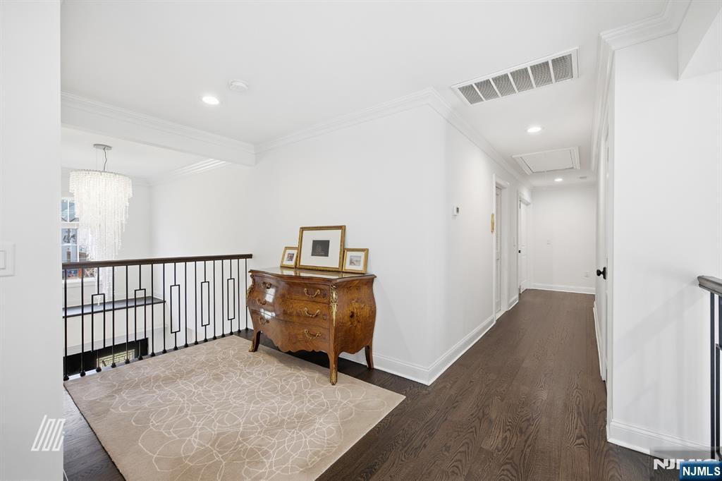 8 Ranch Lane Closter, NJ 07624 - Photo 17 of 36 a view of a hallway to a livingroom with furniture