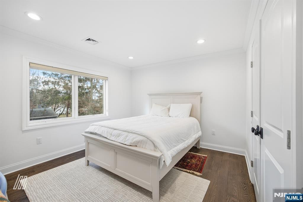 8 Ranch Lane Closter, NJ 07624 - Photo 24 of 36 a bedroom with a bed and a window
