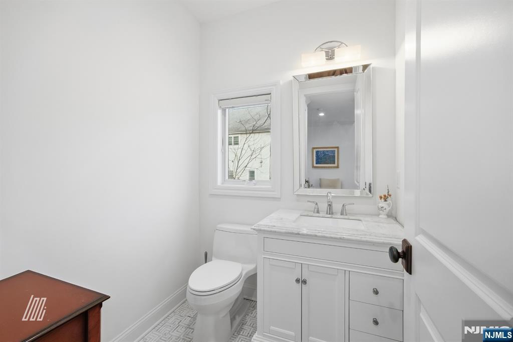 8 Ranch Lane Closter, NJ 07624 - Photo 7 of 36 a bathroom with a sink and a toilet