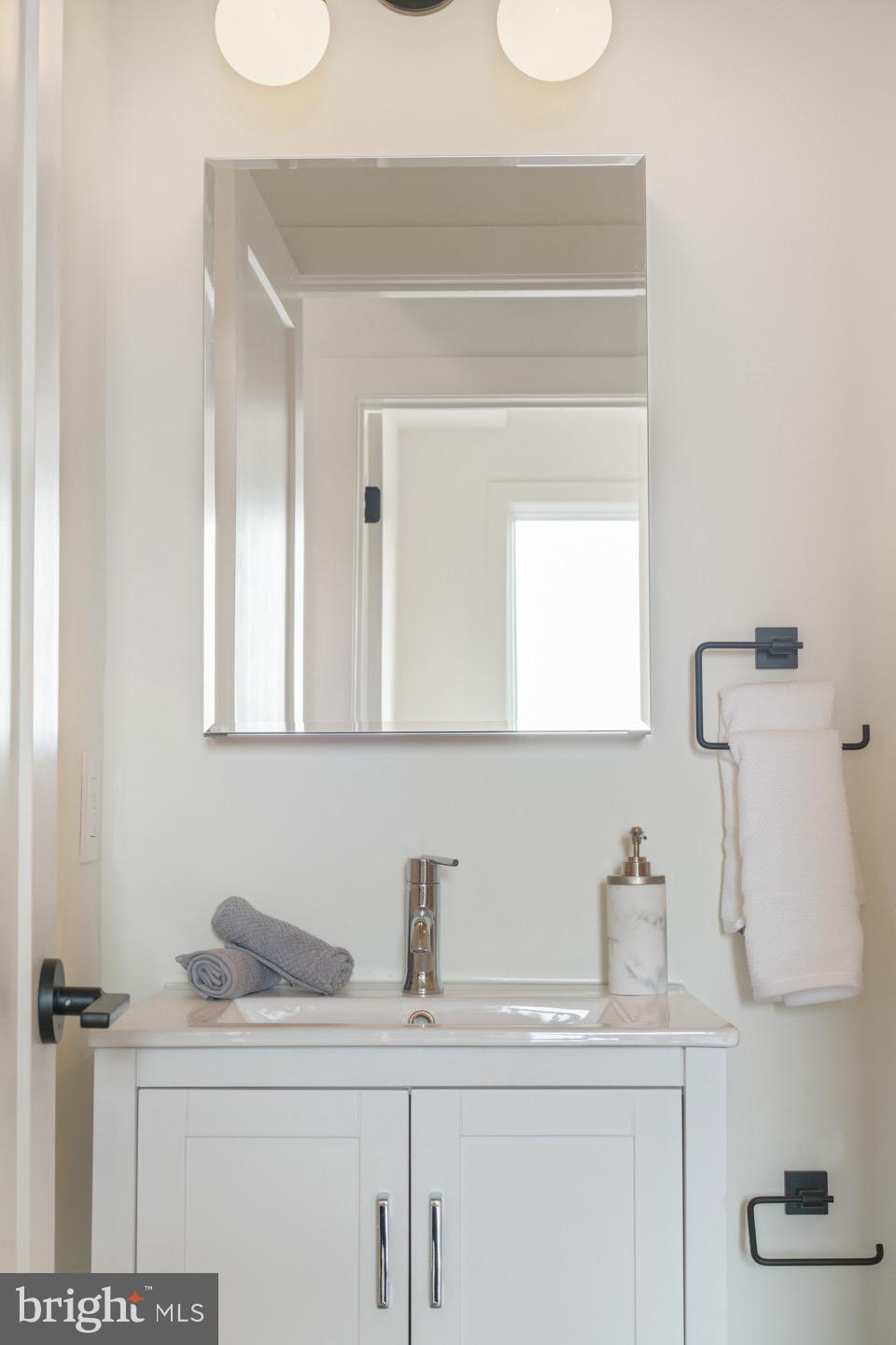 1822 North Front Street, Unit 8 Philadelphia, PA 19122 - Photo 20 of 23 a bathroom with a sink and a mirror