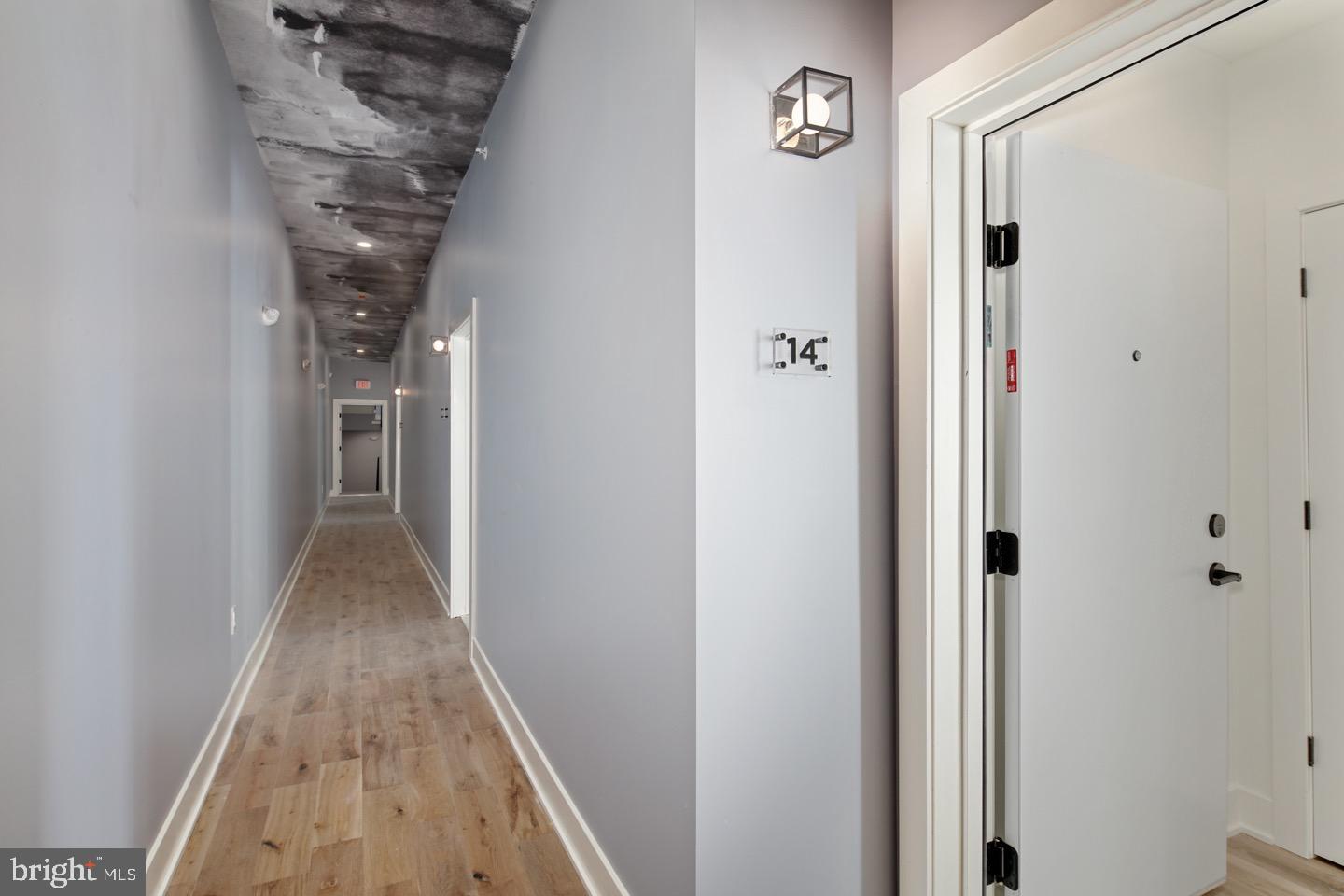 1822 North Front Street, Unit 8 Philadelphia, PA 19122 - Photo 22 of 23 a view of a hallway with wooden floor and entryway