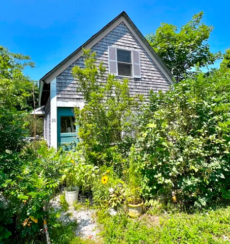 a house view with a backyard space