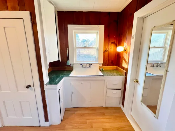 a bathroom with a sink and a mirror