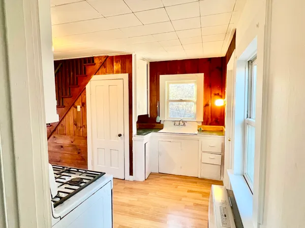 a view of kitchen and utility room with windows