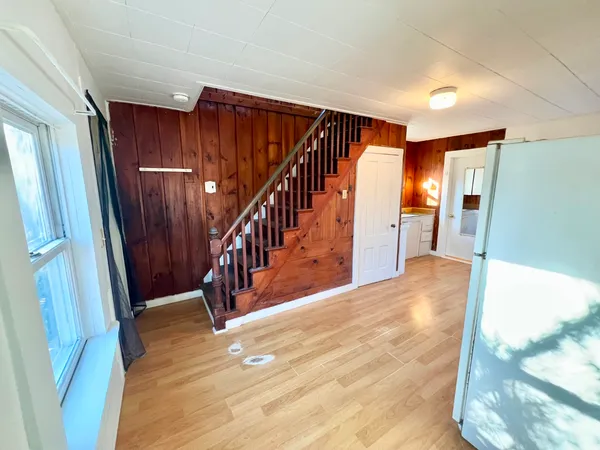 a view of entryway with wooden floor