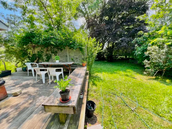 a view of an house with backyard space and garden