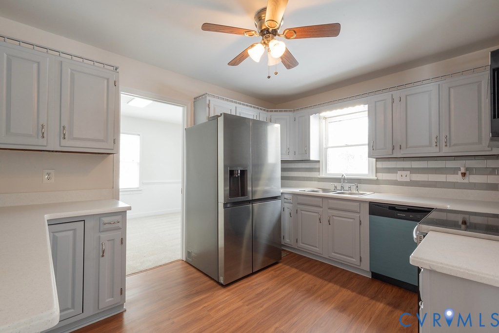 10510 Courtney Road Glen Allen, VA 23060 - Photo 11 of 44 a kitchen with granite countertop stainless steel appliances a sink cabinets and a window