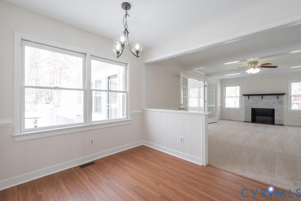 10510 Courtney Road Glen Allen, VA 23060 - Photo 15 of 44 a view of an empty room with wooden floor and a window